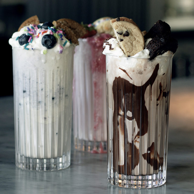 three milkshakes on bartop
