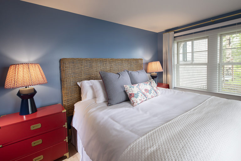Queen bedroom with blue walls in Ocean House