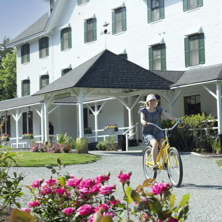 complimentary bike being ridden in front of hotel
