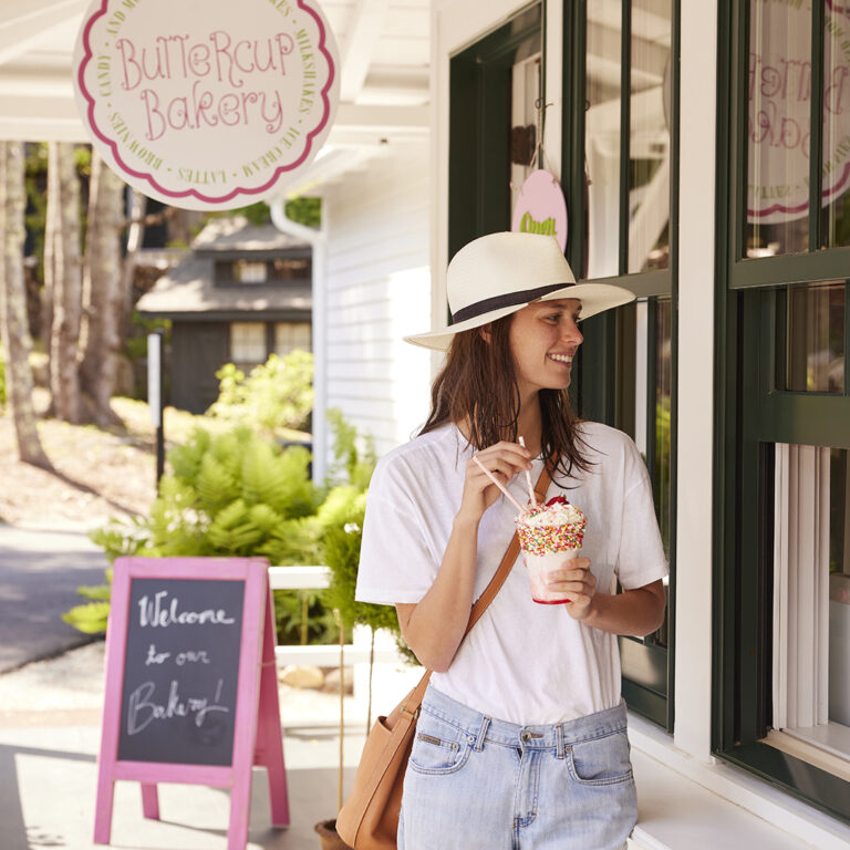 girl with shake at ice cream window
